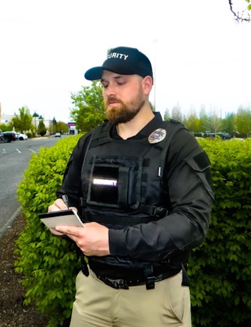 A security guard with a notepad.