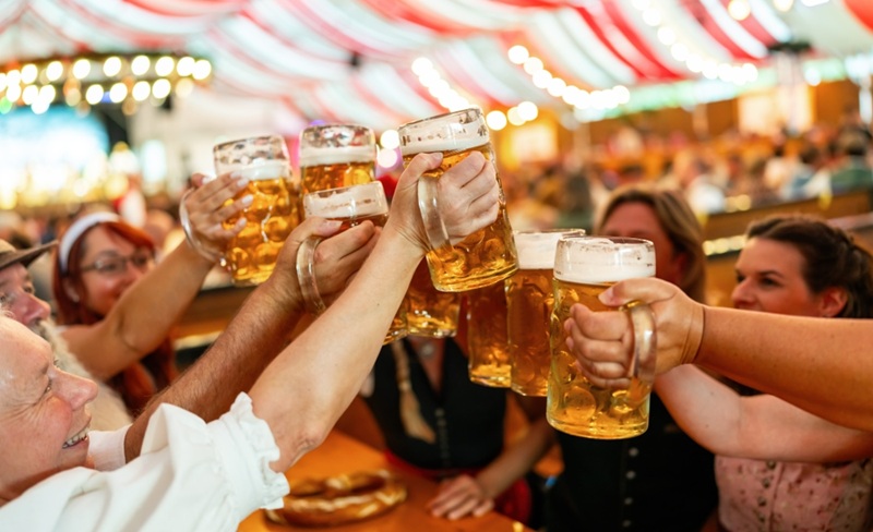 People toasting at an Octoberfest.