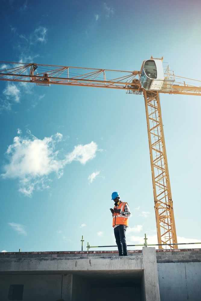 A construction worker and crane