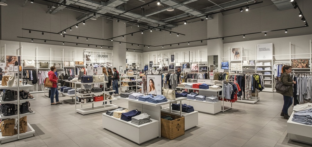 People shopping a clothing store.