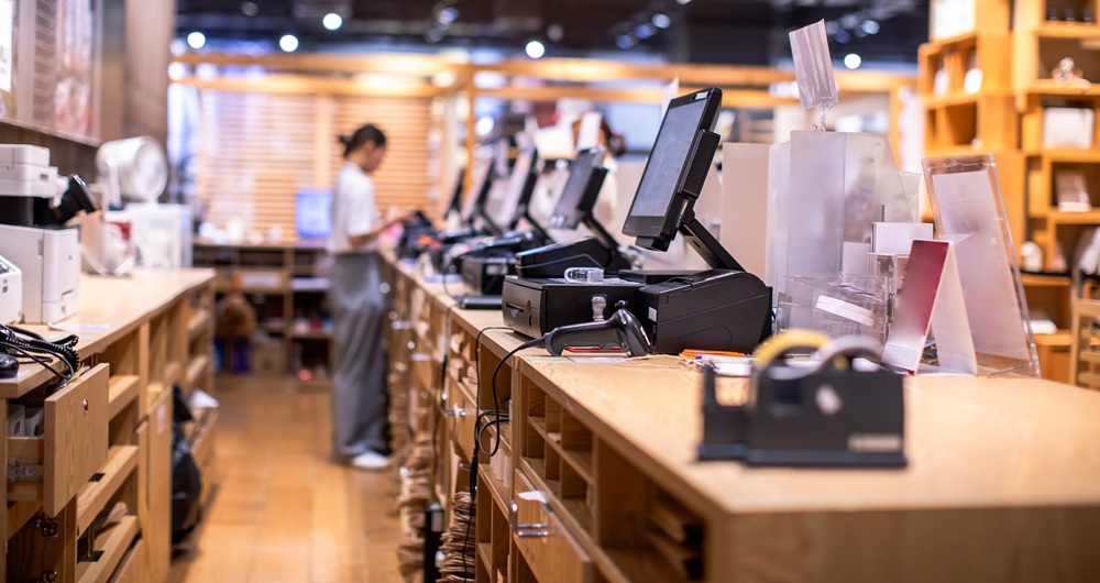 Behind the counter of a retail store.