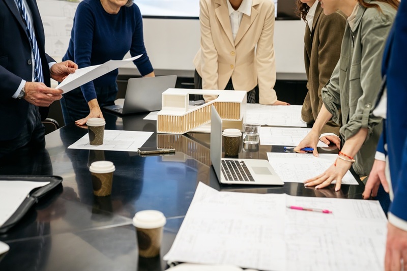 A team planning security measures at a conference table.