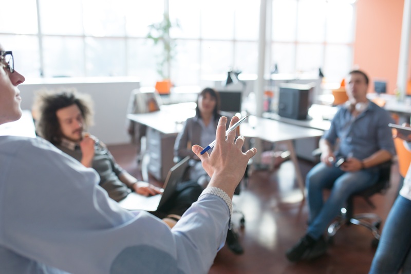 Group of business people discussing security in the office.